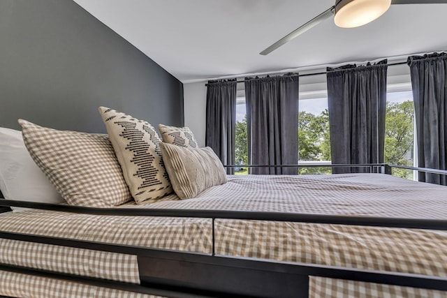 bedroom with ceiling fan and lofted ceiling