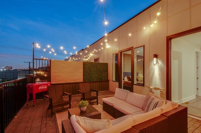 view of patio featuring outdoor lounge area and a balcony