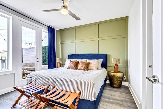 bedroom with access to exterior, ceiling fan, and wood-type flooring