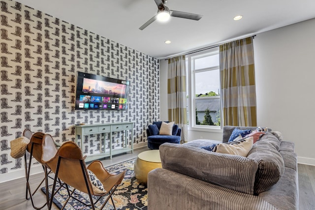 living room with ceiling fan and hardwood / wood-style floors