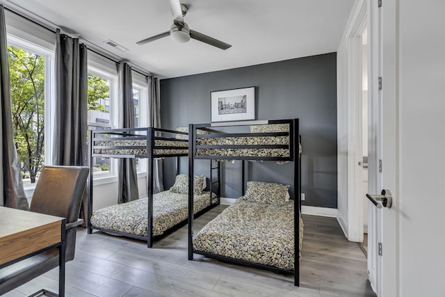 bedroom featuring hardwood / wood-style flooring and ceiling fan