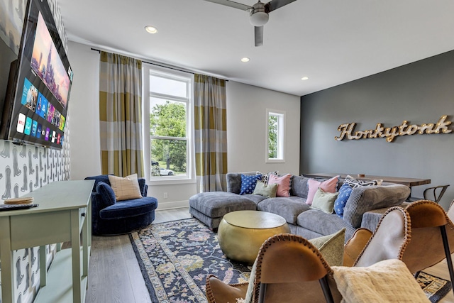 living room featuring hardwood / wood-style flooring and ceiling fan