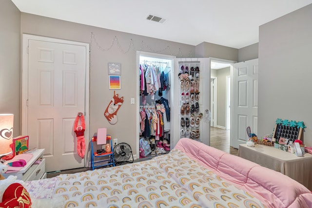 bedroom featuring hardwood / wood-style flooring and a closet