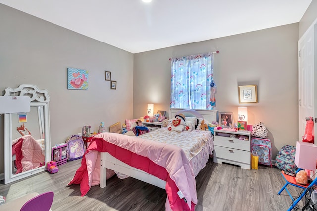 bedroom with light hardwood / wood-style floors