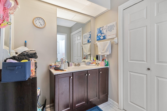 bathroom with tile flooring and large vanity