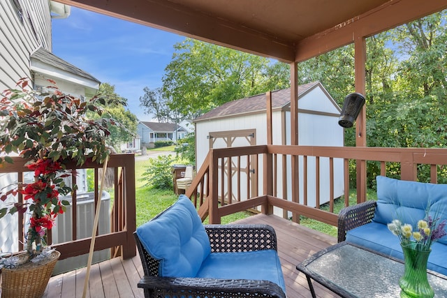 wooden terrace featuring a shed