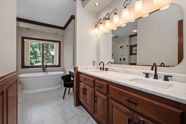 bathroom with plus walk in shower, vanity, and crown molding