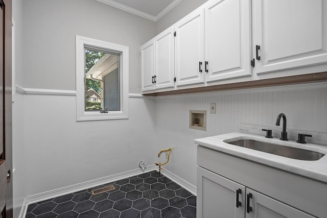 laundry area with cabinets, washer hookup, ornamental molding, gas dryer hookup, and sink