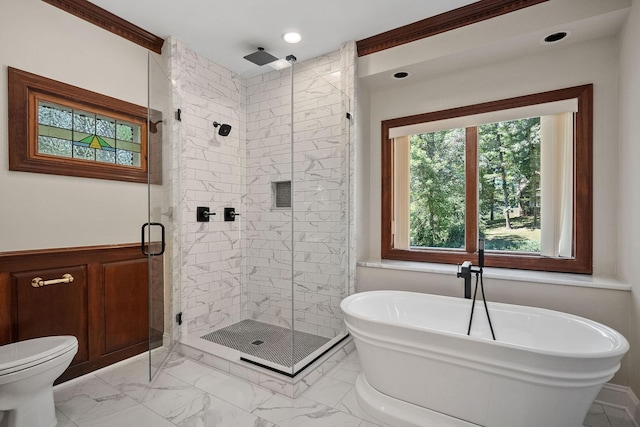 bathroom featuring toilet and shower with separate bathtub