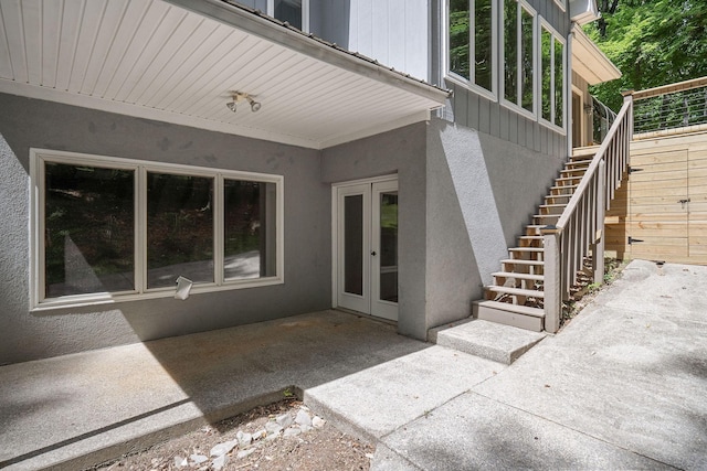 entrance to property with french doors and a patio