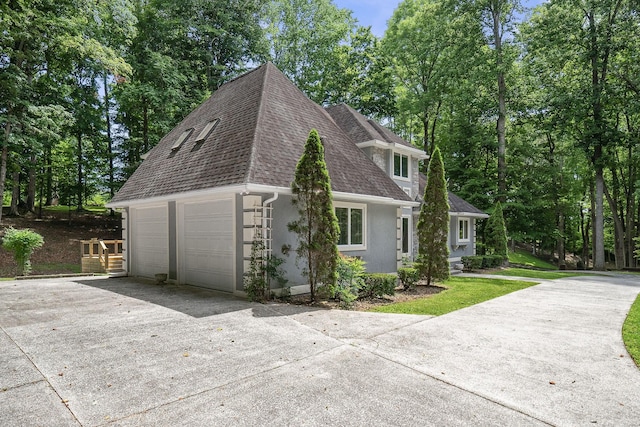 view of side of home with a garage