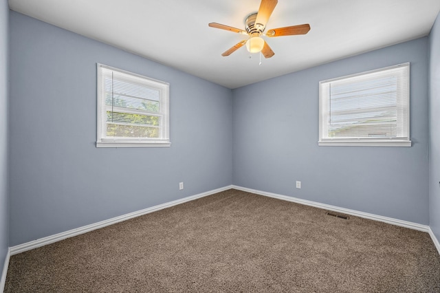 carpeted empty room with ceiling fan