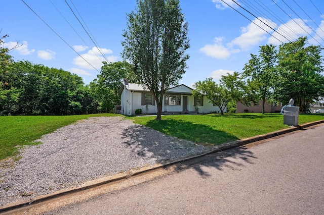 ranch-style house with a front yard