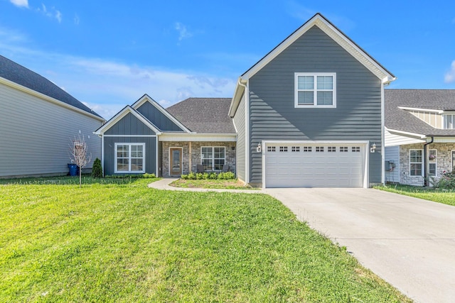 view of property with a front yard and a garage