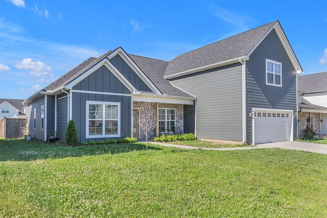 view of front of house with a garage and a front lawn