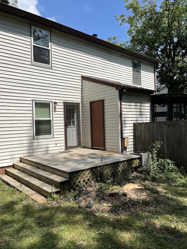 back of property featuring a wooden deck