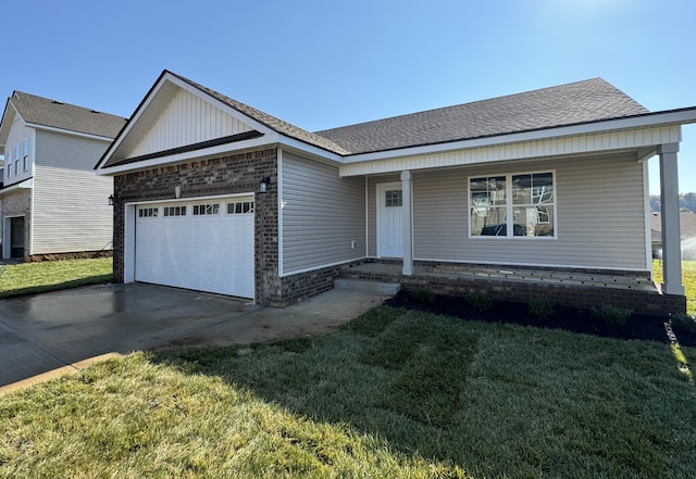 view of front of home featuring a garage and a front lawn