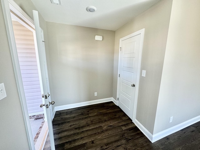 doorway to outside featuring dark wood-type flooring