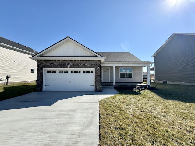 view of front of property with a garage and a front yard