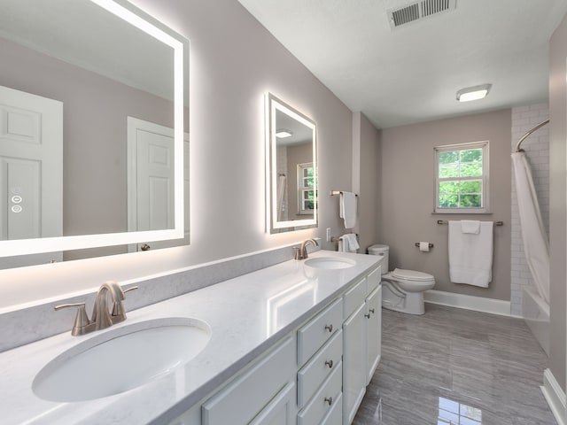 full bathroom with shower / bathtub combination with curtain, double vanity, toilet, and tile floors