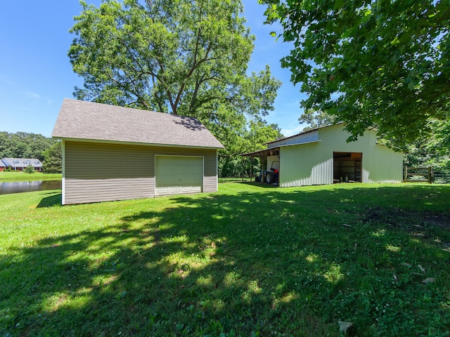 view of yard with an outdoor structure and a garage