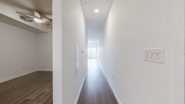 hall with dark hardwood / wood-style floors