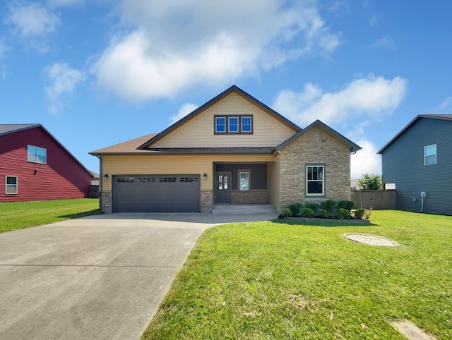 craftsman-style house featuring a front lawn and a garage