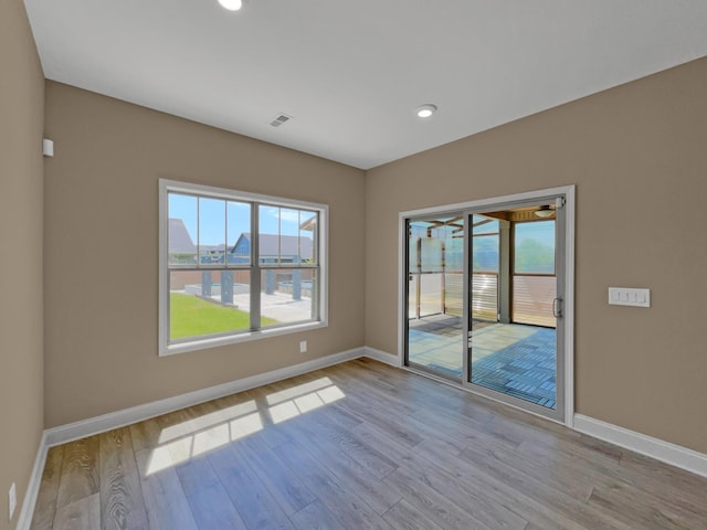 spare room with light wood-type flooring