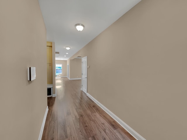 hallway with light hardwood / wood-style flooring