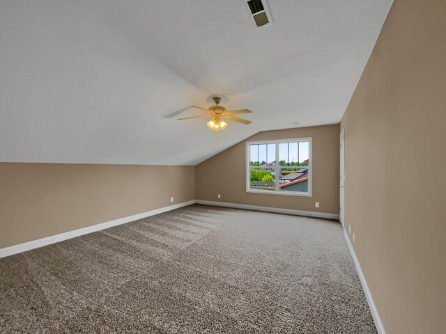 additional living space with carpet, vaulted ceiling, and ceiling fan