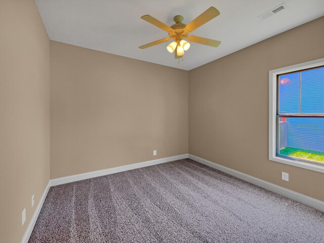 carpeted empty room with ceiling fan