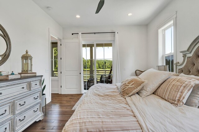 bedroom with ceiling fan, dark hardwood / wood-style flooring, access to outside, and multiple windows