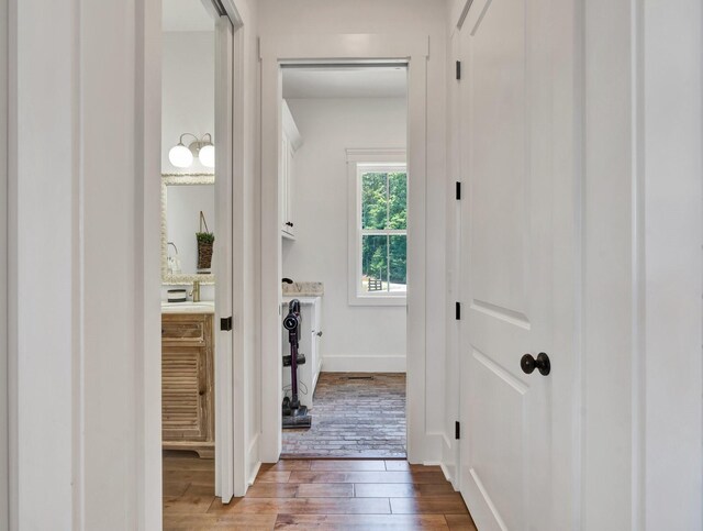 corridor with wood-type flooring