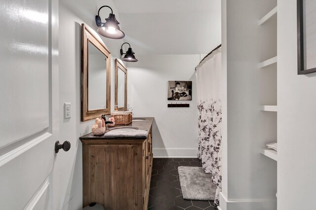 bathroom with tile patterned flooring and vanity