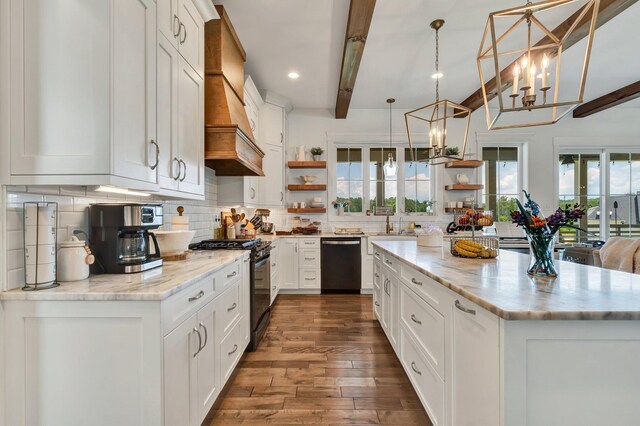 kitchen featuring white cabinets, black gas stove, hanging light fixtures, stainless steel dishwasher, and beam ceiling