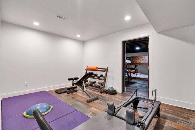 exercise area featuring wood-type flooring