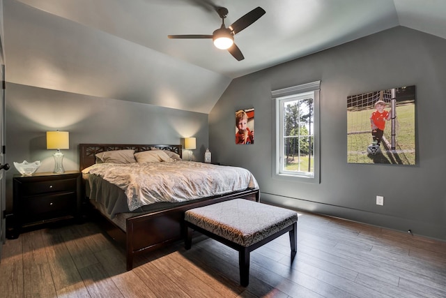 bedroom with hardwood / wood-style flooring, vaulted ceiling, and ceiling fan