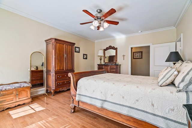 bedroom with ceiling fan, crown molding, and light hardwood / wood-style flooring