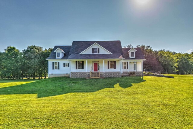 view of front of home with a porch and a front yard