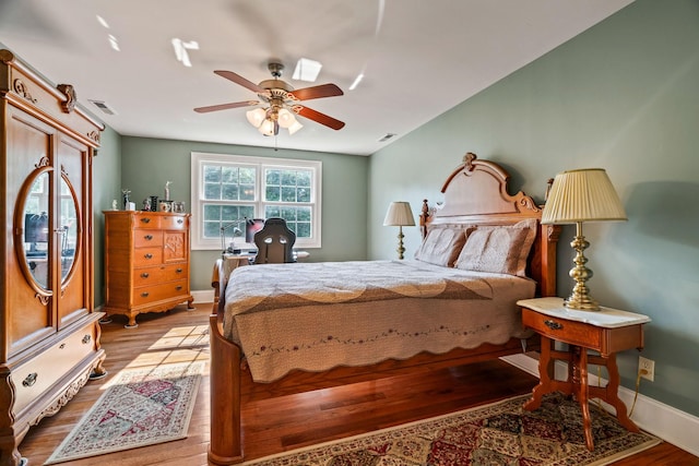 bedroom featuring ceiling fan and light hardwood / wood-style flooring