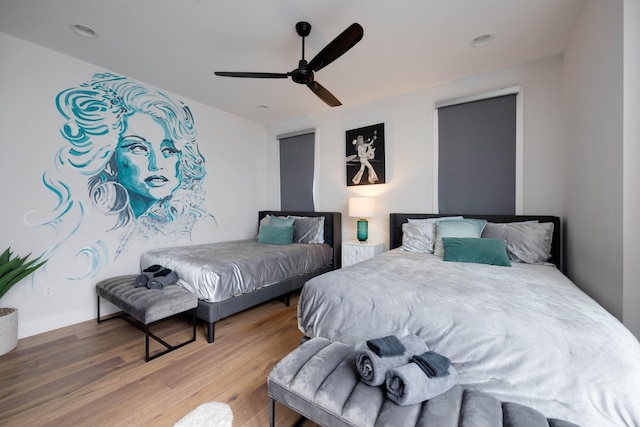 bedroom featuring hardwood / wood-style floors and ceiling fan