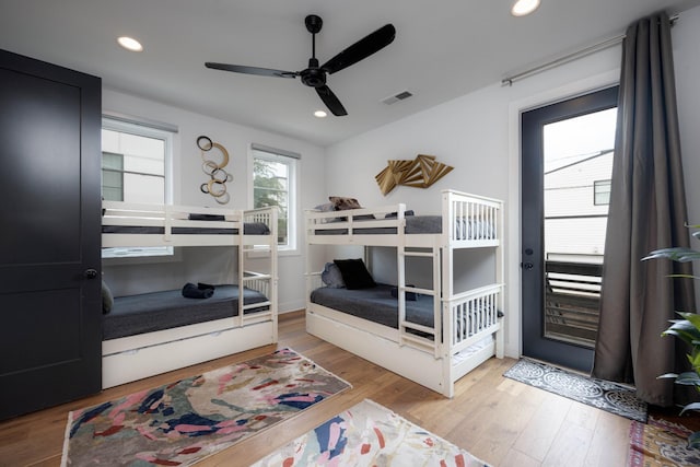 bedroom with ceiling fan and light wood-type flooring