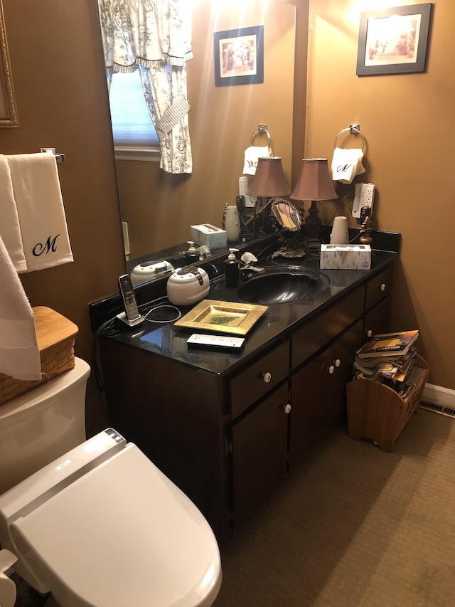 bathroom featuring vanity and visible vents