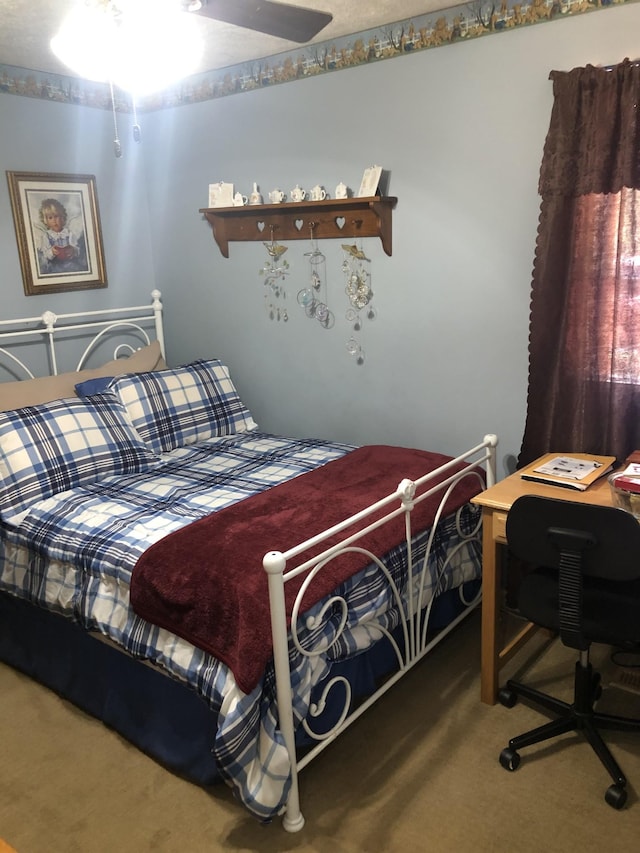 bedroom featuring ceiling fan and carpet floors