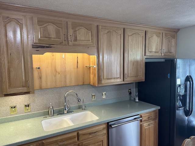 kitchen featuring a textured ceiling, dishwasher, black fridge with ice dispenser, and sink