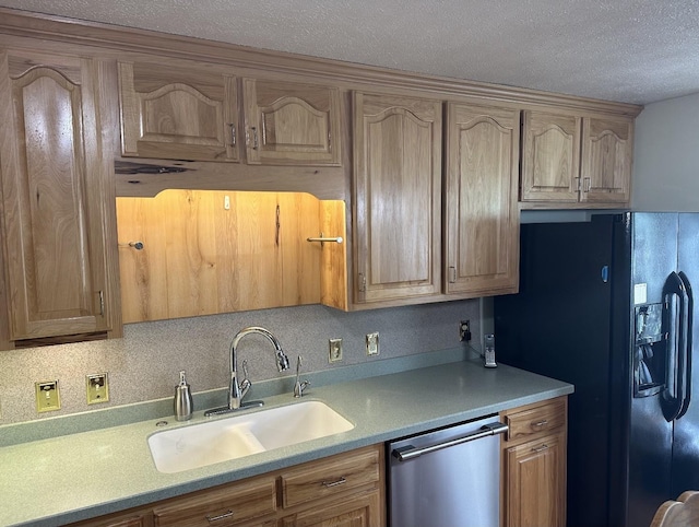 kitchen with a sink, light countertops, a textured ceiling, dishwasher, and black refrigerator with ice dispenser