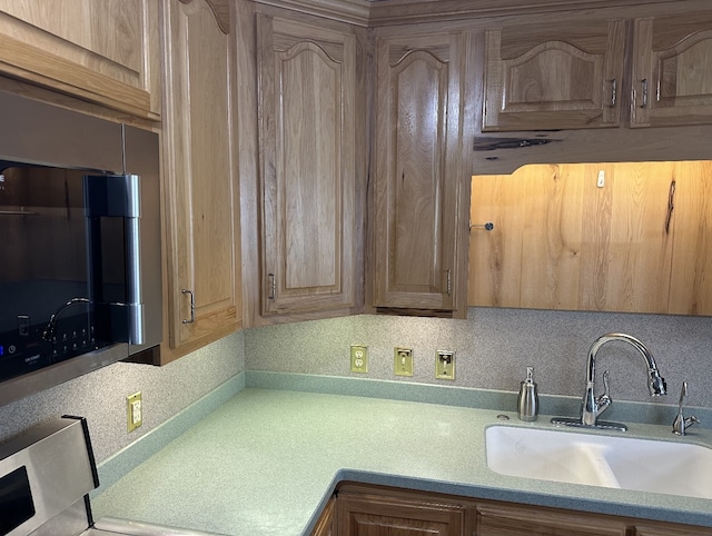 kitchen with tasteful backsplash and sink