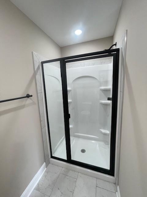 bathroom featuring an enclosed shower