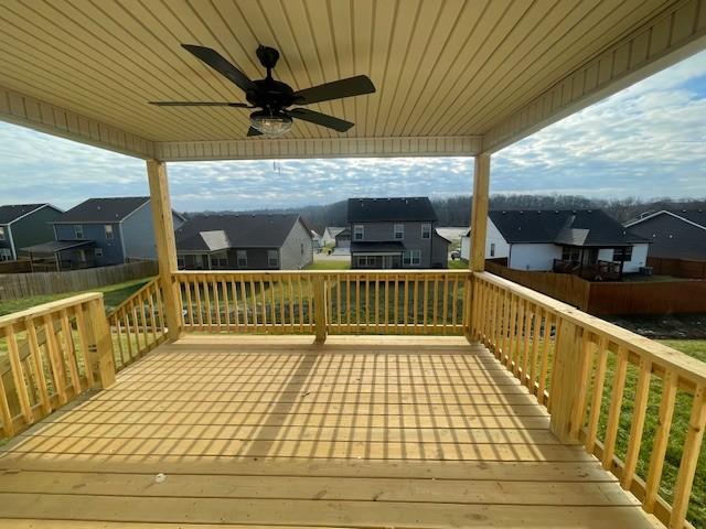 wooden terrace featuring ceiling fan