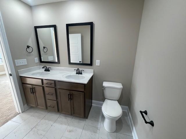 bathroom with vanity and toilet